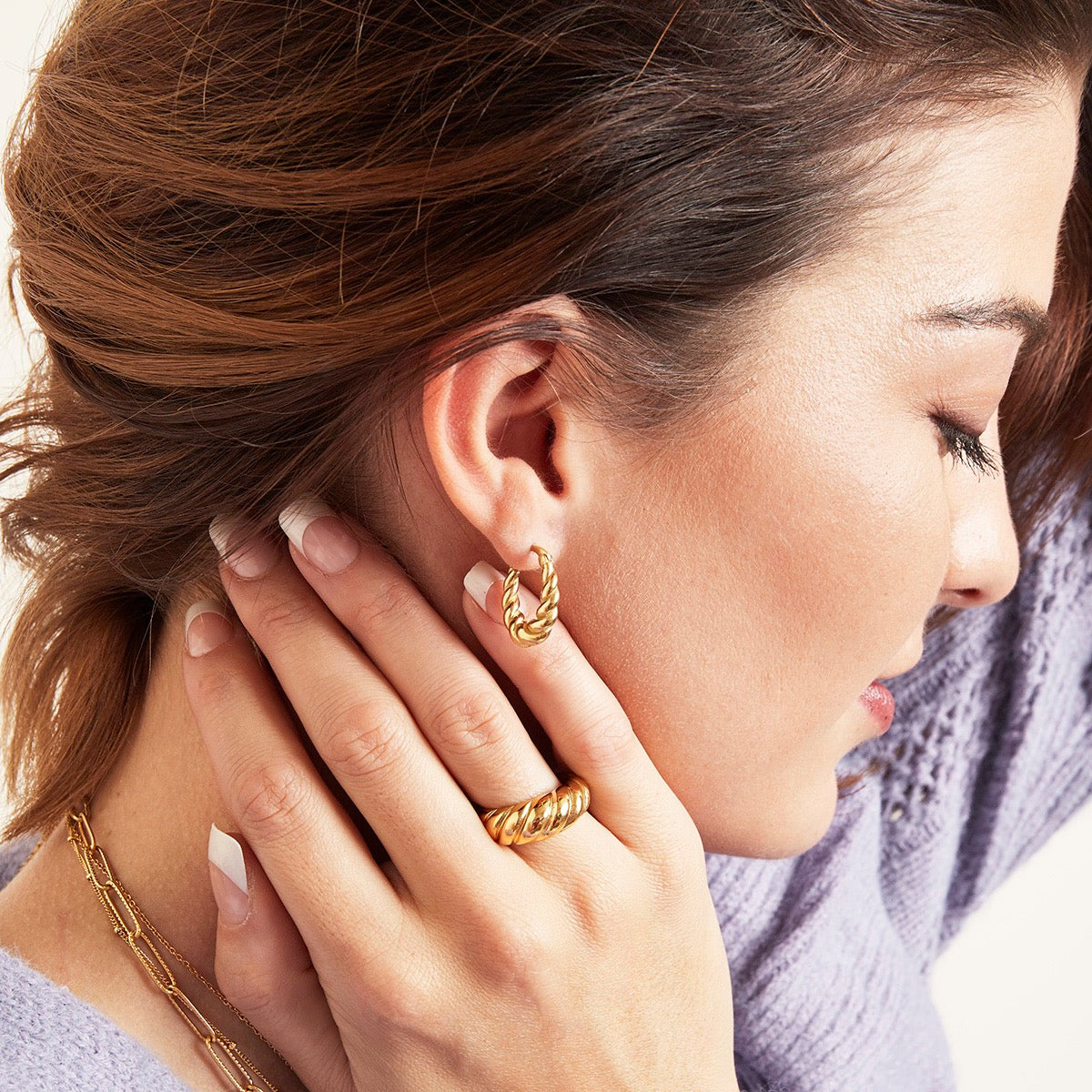 Oorbellen dangling twist goud